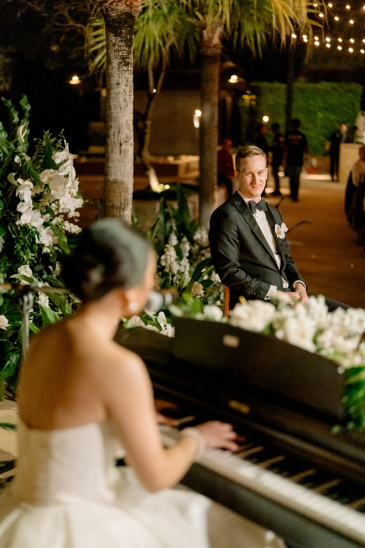 bride singing to groom at reception